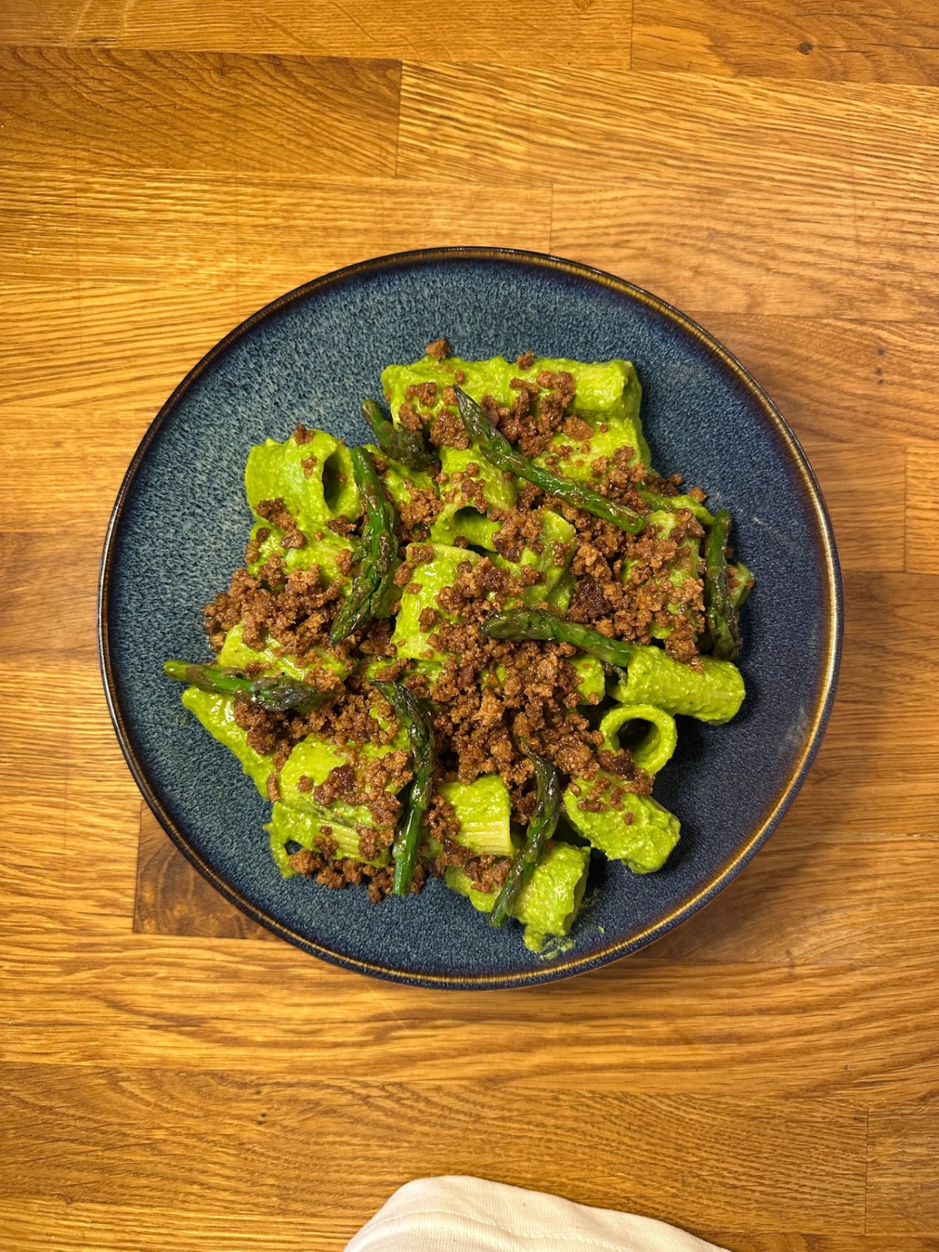 Rigatoni in pea and basil cream with crisp seitan crumble and charred asparagus