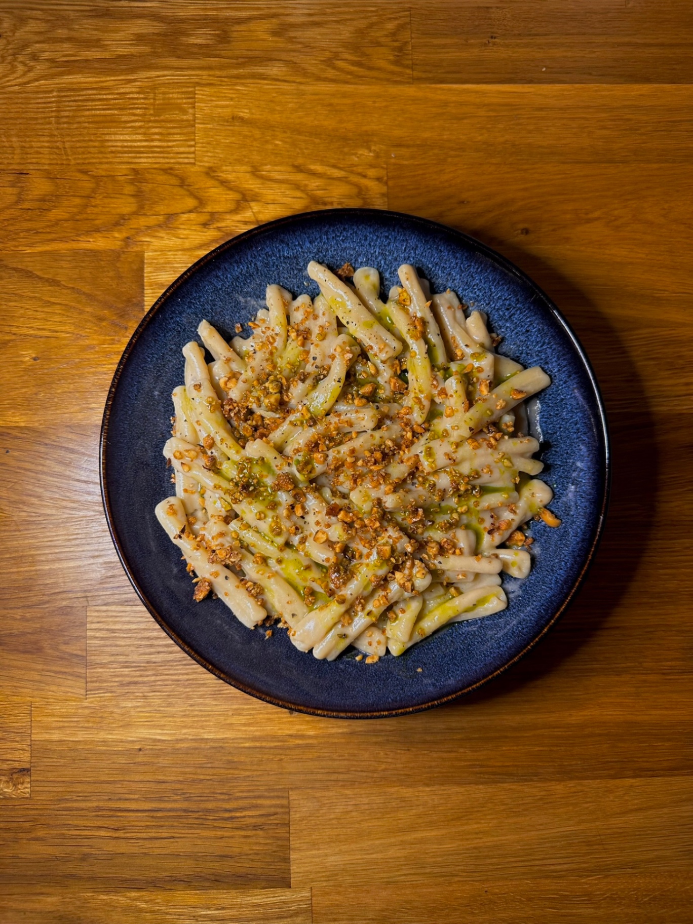 Casarecce in cashew cream finished with toasted hazelnut and basil oil