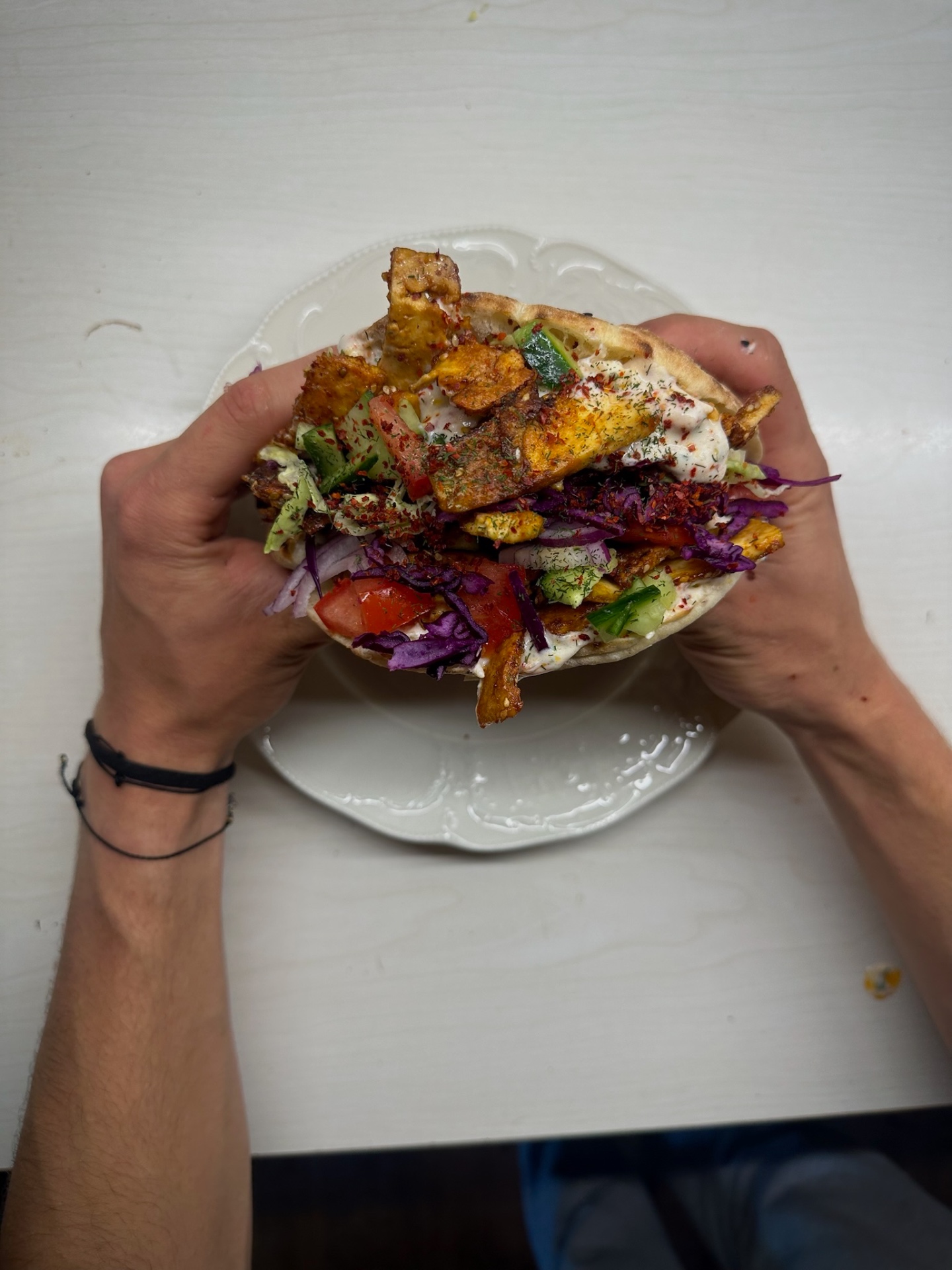 Vegan döner with crispy tofu, pickled red cabbage and herbed soy tzatziki in warm flatbread